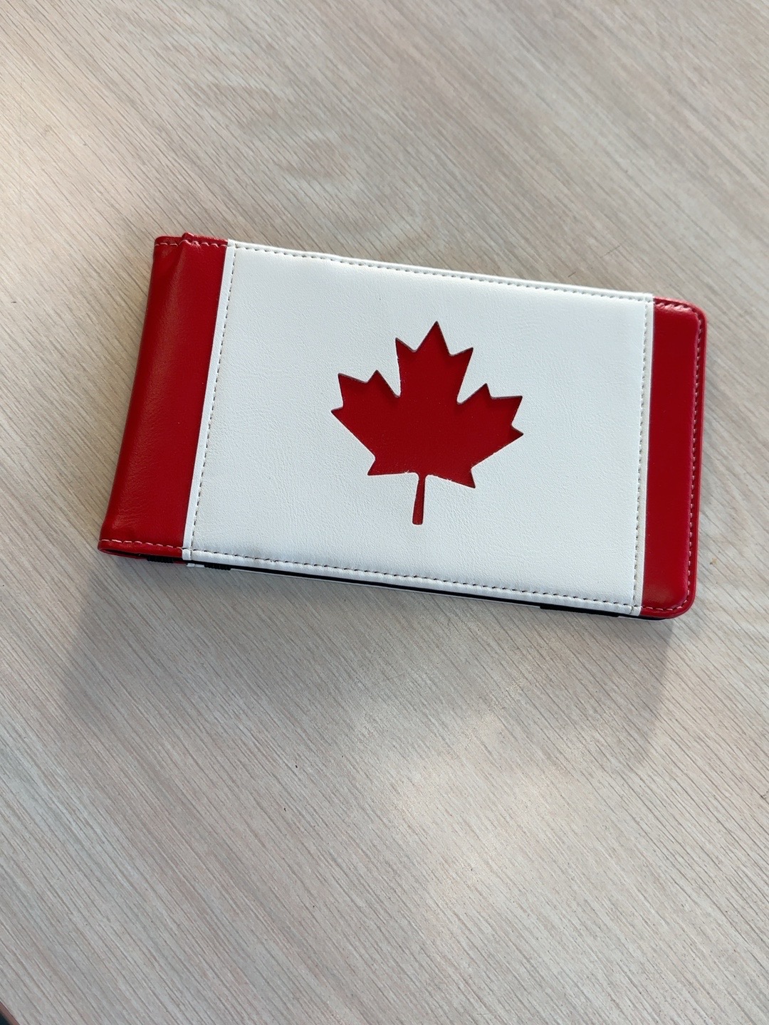 Closed red and white yardage-book holder