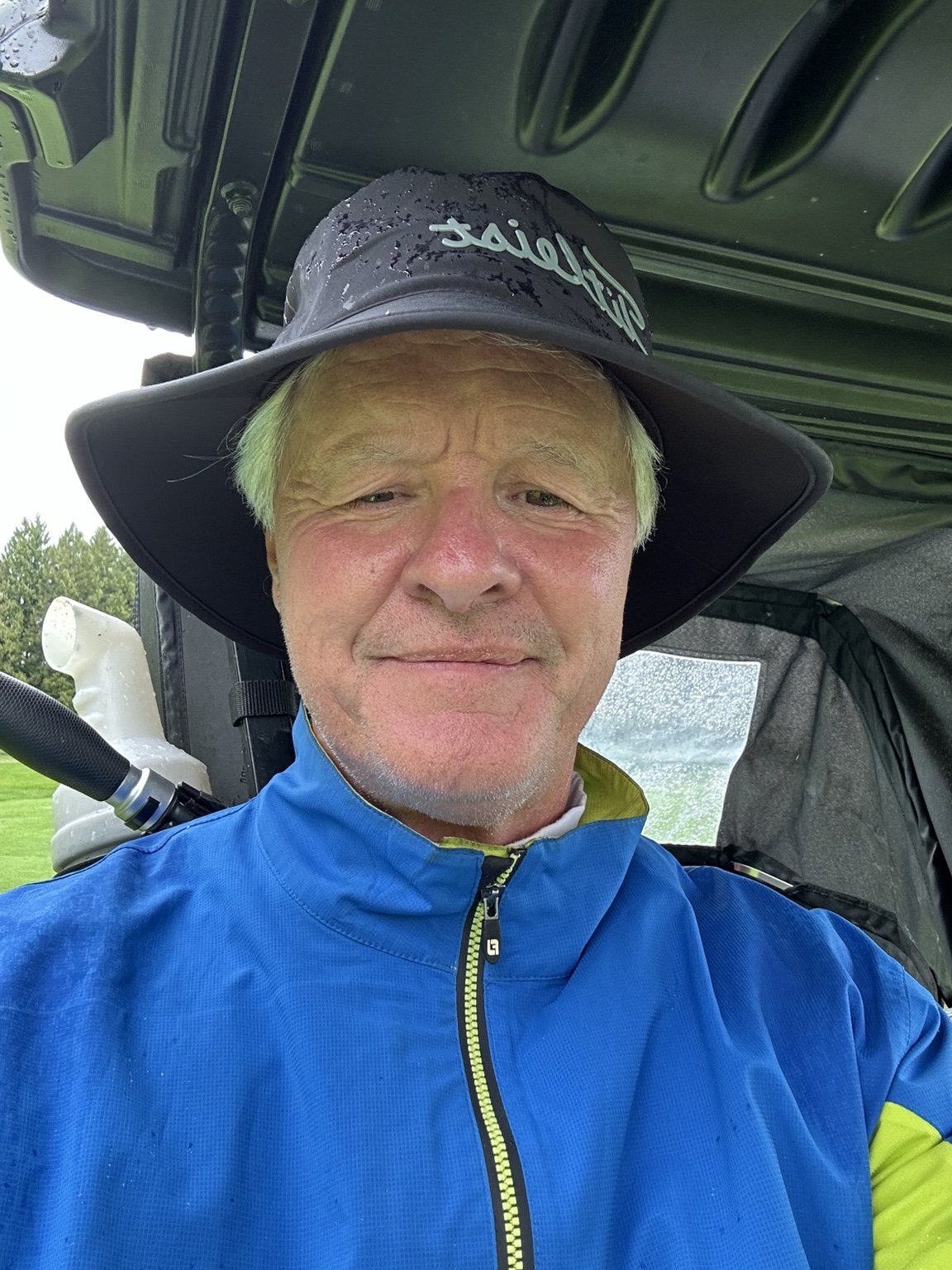 Storm in a rain hat and blue golf jacket